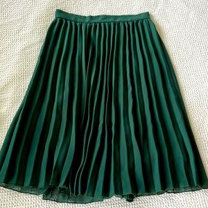 Green pleated skirt